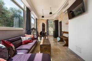 a living room with a couch and a table at Biancaluna Luxury Retreat by Perle di Puglia in Ostuni