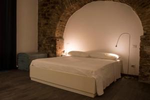 Postel nebo postele na pokoji v ubytování Residenza La Corte Assisi