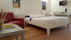 A bed or beds in a room at Il Cortile del Marchese Beccadelli