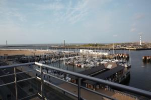 a marina with alot of boats in the water at Oostende Zeezicht Visserskaai in Ostend