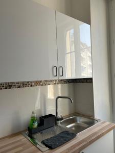 a kitchen counter with a sink and a sink at Le Rouet in Marseille