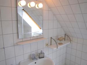 a bathroom with a sink and a mirror at Haus Leißner in Büsum +10 photos