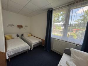 Posteľ alebo postele v izbe v ubytovaní Resort Kovács
