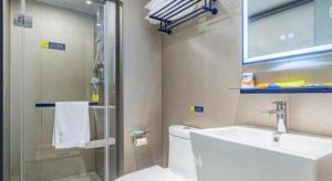 a bathroom with a toilet and a sink and a shower at 7 Days Inn Nanjing Xinjiekou Changfu Street Metro Station in Nanjing +174 photos