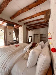 Letto o letti in una camera di Atlantis 12, Maison d'hôtes et d'art