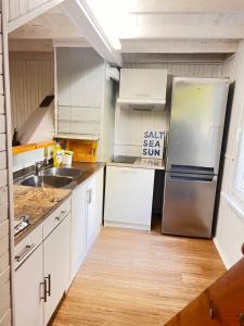 Kuchyň nebo kuchyňský kout v ubytování Domek Letniskowy + 12 fotografií