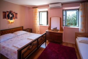 Postel nebo postele na pokoji v ubytování Apartment Postup