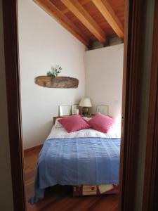 Säng eller sängar i ett rum på Casa Vacanze Roncaiola
