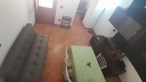 an overhead view of a room with a green table at Portico Ratti in Riva Ligure