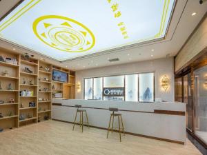 a shop with a large skylight in a room with shelves at Yimi Hotel Guangzhou Yuexiu Park North Branch in Guangzhou