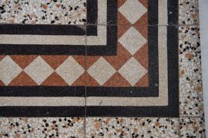 a close up of a tiled floor with at Buonanotte Rooms in Lucca