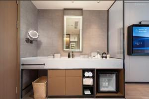 Ένα μπάνιο στο Atour Hotel Zhengzhou Manhattan Future Road