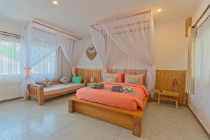Posteľ alebo postele v izbe v ubytovaní CoCo Breeze Spa Hotel