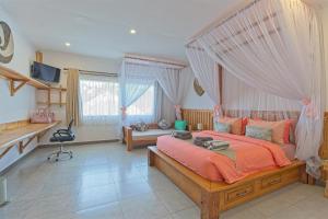 Postel nebo postele na pokoji v ubytování CoCo Breeze Spa Hotel + 33 fotografií