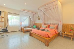 Posteľ alebo postele v izbe v ubytovaní CoCo Breeze Spa Hotel