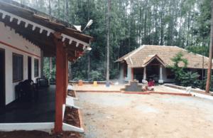 a house under construction with a large yard at Silver Shadow Homestay in Chikmagalūr
