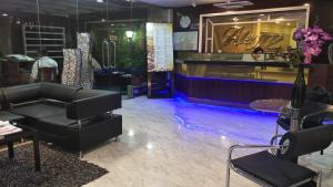 a store with a couch and chairs in a room at Alegro Hotel Catbalogan in Catbalogan