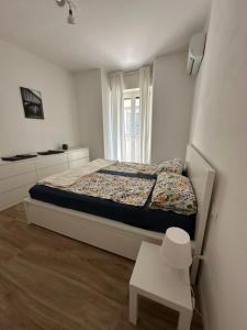 Ένα ή περισσότερα κρεβάτια σε δωμάτιο στο AP Casa Sarnico