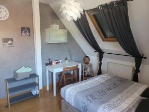 Postel nebo postele na pokoji v ubytování Le jardin