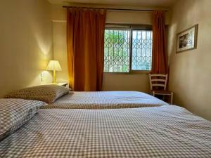 a bedroom with two twin beds and a window at Holiday Home Côte d'Azur in Mougins +54 photos