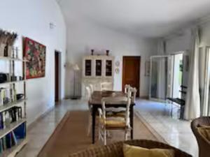 a living room with a table and chairs at Holiday Home Côte d'Azur in Mougins