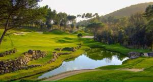 a view of a golf course with a pond at Holiday Home Côte d'Azur in Mougins