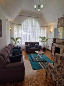 Posezení v ubytování Teresita Home JKIA
