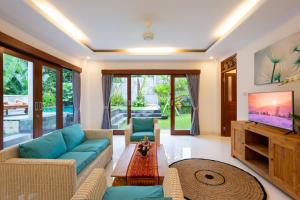 Телевизор и/или развлекательный центр в Villa Uma Sari Dayuh Between Canggu & Ubud