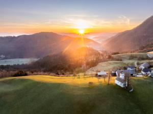 an aerial view of a golf course at sunset at Apartments Saint Thomas in Selca