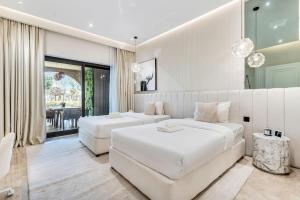 Ein Bett oder Betten in einem Zimmer der Unterkunft DAYF-FMT Fairmont Palm with Pool and Beach Access