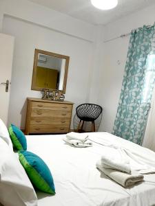 A bed or beds in a room at "Villa Kanavos" apts