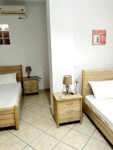 A bed or beds in a room at "Villa Kanavos" apts