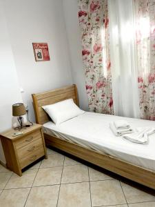 A bed or beds in a room at "Villa Kanavos" apts