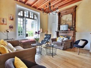 a living room with couches and a fireplace at Maison 6 chambres proche plage avec WiFi et salle de jeux - FR-1-197-447 in Les Sables-dʼOlonne