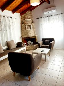A seating area at "Villa Kanavos" apts