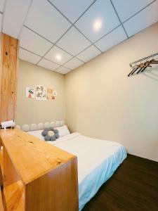 Postel nebo postele na pokoji v ubytování Harmony Nest homestay