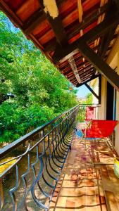 a group of chairs sitting on a balcony at Chez le Grand in Maraussan +31 photos