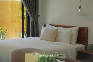 Voodi või voodid majutusasutuse QR Hotel Dalat toas