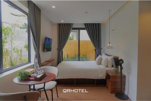 Voodi või voodid majutusasutuse QR Hotel Dalat toas