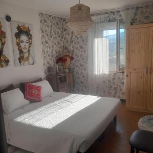 A bed or beds in a room at B&b Boblin blu