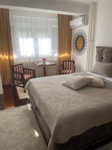 Cama o camas de una habitación en VERA apartman