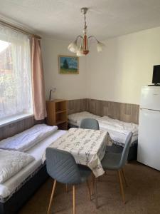 Postel nebo postele na pokoji v ubytování Apartmány Jedovnice
