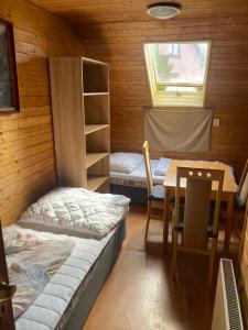 Postel nebo postele na pokoji v ubytování Apartmány Jedovnice