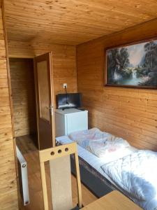 Postel nebo postele na pokoji v ubytování Apartmány Jedovnice