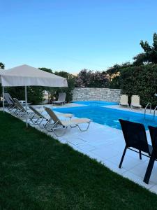 The swimming pool at or close to "Villa Kanavos" apts