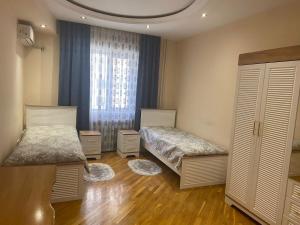 Ένα ή περισσότερα κρεβάτια σε δωμάτιο στο Mega City