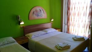 Postel nebo postele na pokoji v ubytování Hotel Simon
