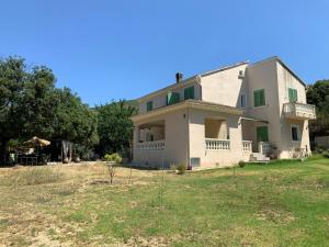 a large white house with a yard at U FARNIENTE in Patrimonio +37 photos