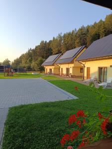 a row of buildings with solar panels on their roofs at Domki pod Grapą in Trybsz