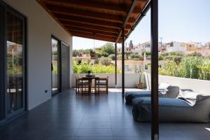 a living room with a couch and a table at MV Living - Retreat in Daratso